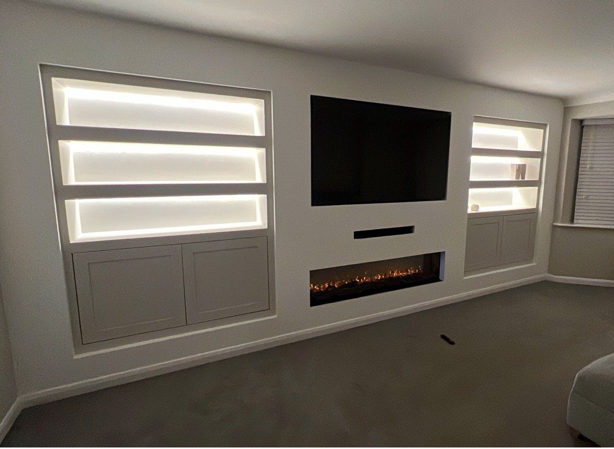 Media walls with LED lighting, storage and a premium finish.